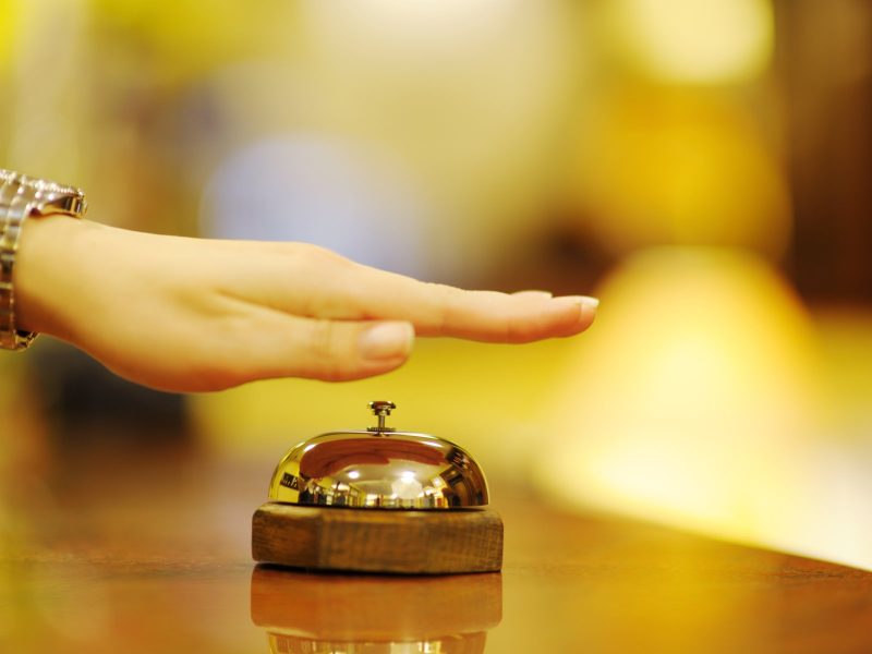 business woman  at the reception of a hotel checking in